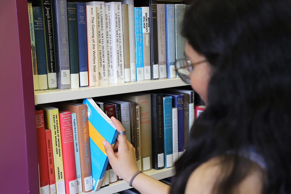 Image of person browsing library collection