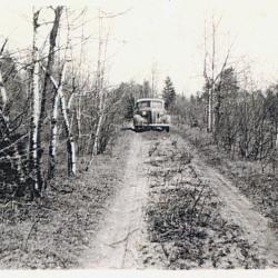 Photographs of a northern highway/Blind River, receipts for monthly allowance, and
      banking book