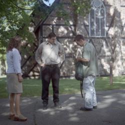 Photographs of students by the chapel